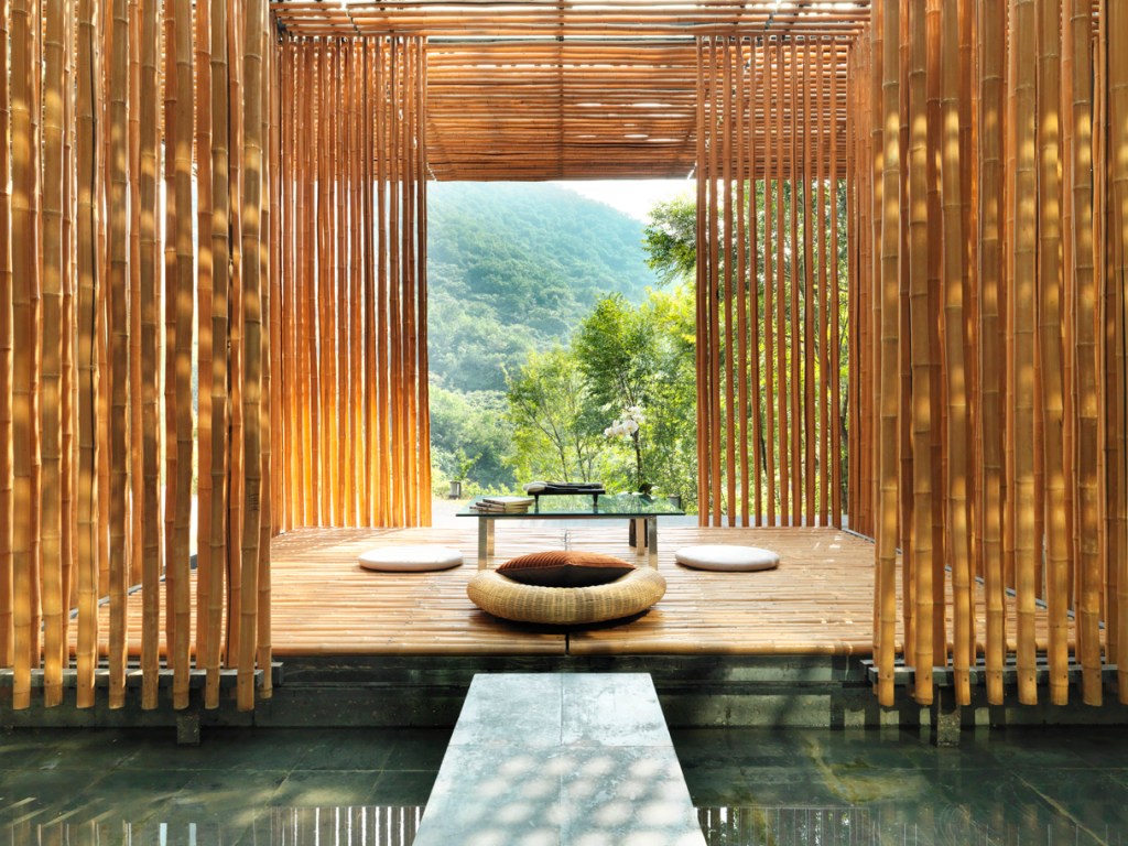 a pretty forest scene with a spa and a bamboo wall at Commune by the Great Wall in the Yangqing District of Beijing, marking the sixth property in China for The Unbound Collection by Hyatt brand