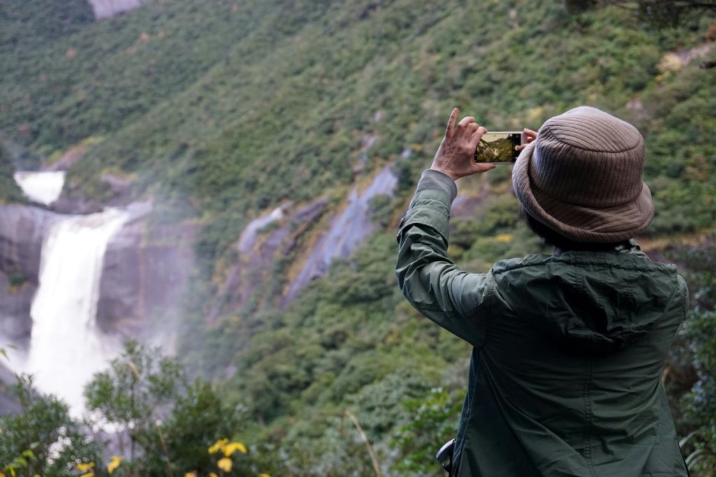 Man taking photo in jacket