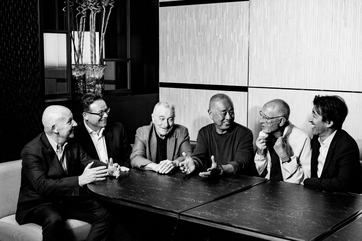 On the left, Trevor Horwell, CEO of Nobu Hospitality, sat with Nobu's co-founders, Robert De Niro, Nobu Matsuhisa, Meir Teper, and some shareholders and leaders. Source: Skift.
