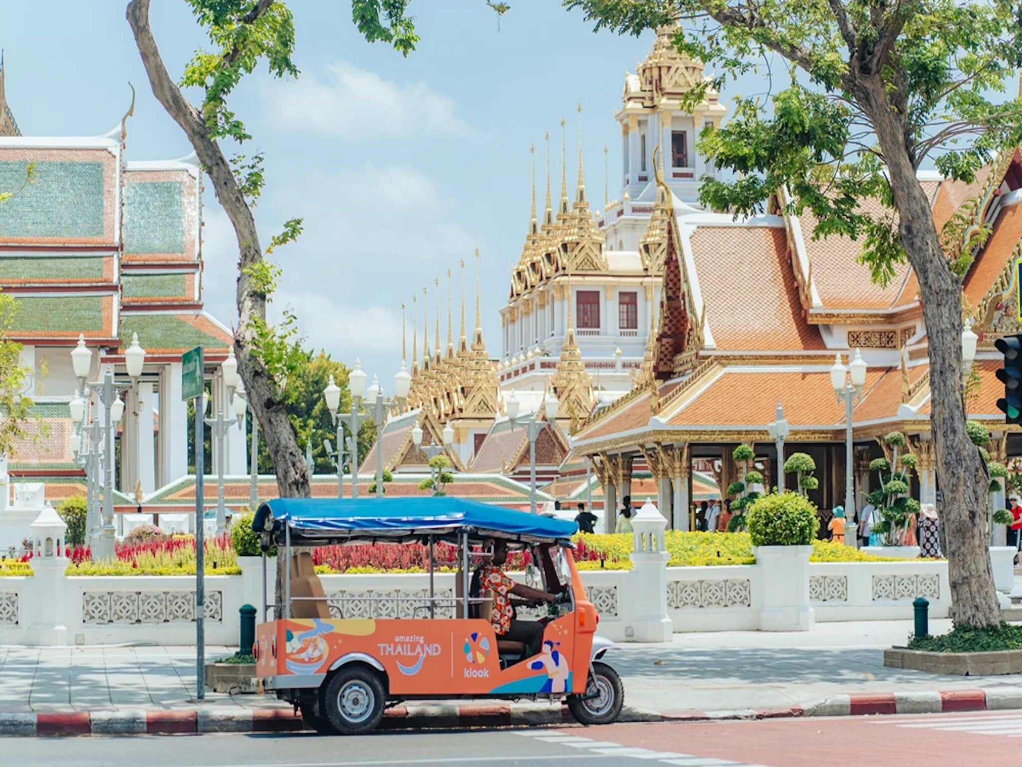 Klook & Thailand Tourism Authority Tuk Tuk at Wat Ratchanadda and the Loha Prasat, Buddhist temples in Bangkok. Source: Klook