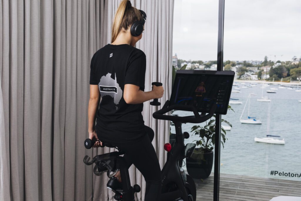 person riding a peloton machine