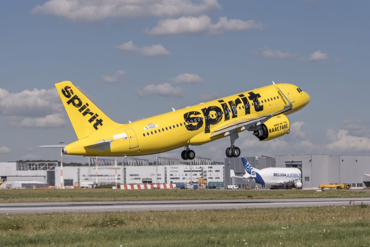 An A320neo for Spirit Airlines taking off from the runway.