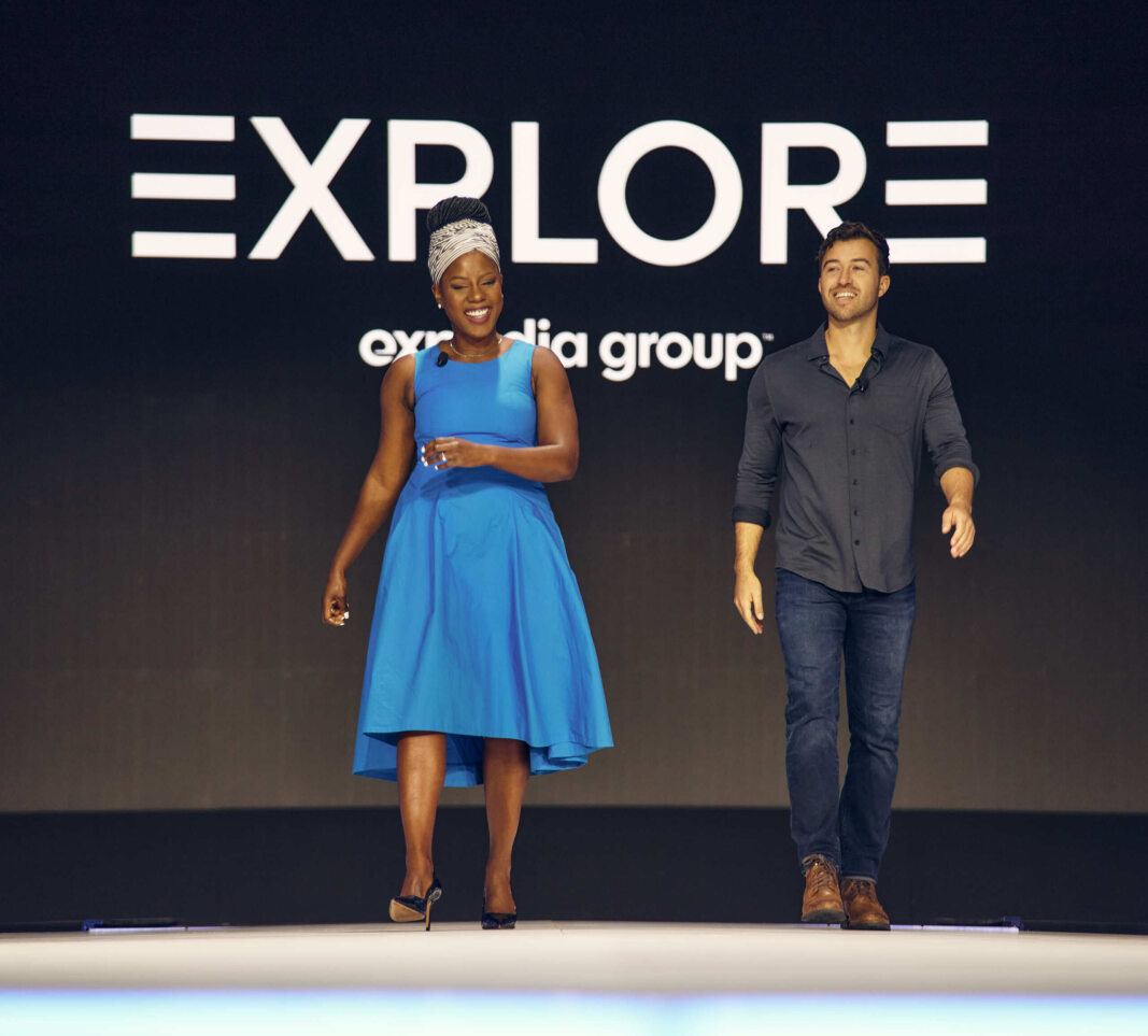 Two social media influencers, a woman and a man, were on stage at the Expedia Explore 24 conference May 14, 2024 in Las Vegas.