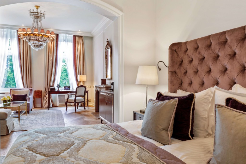 a guest room from the view of the bed at Fairmont Hotel Vier Jahreszeiten source accor hotels