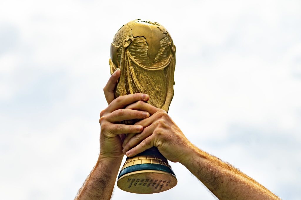 Hands holding a trophy in the air