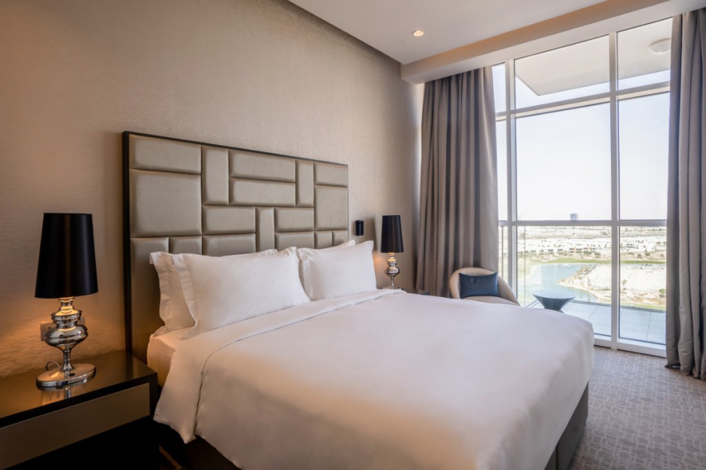 a guest bedroom at a hotel, Radisson Dubai DAMAC Hills