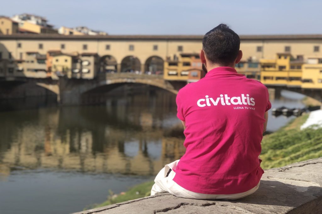 A person with a Civitatis shirt looking out at Florence