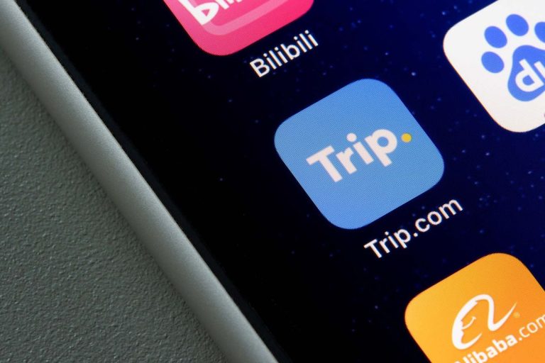Trip.com mobile app icon is seen on an iPhone