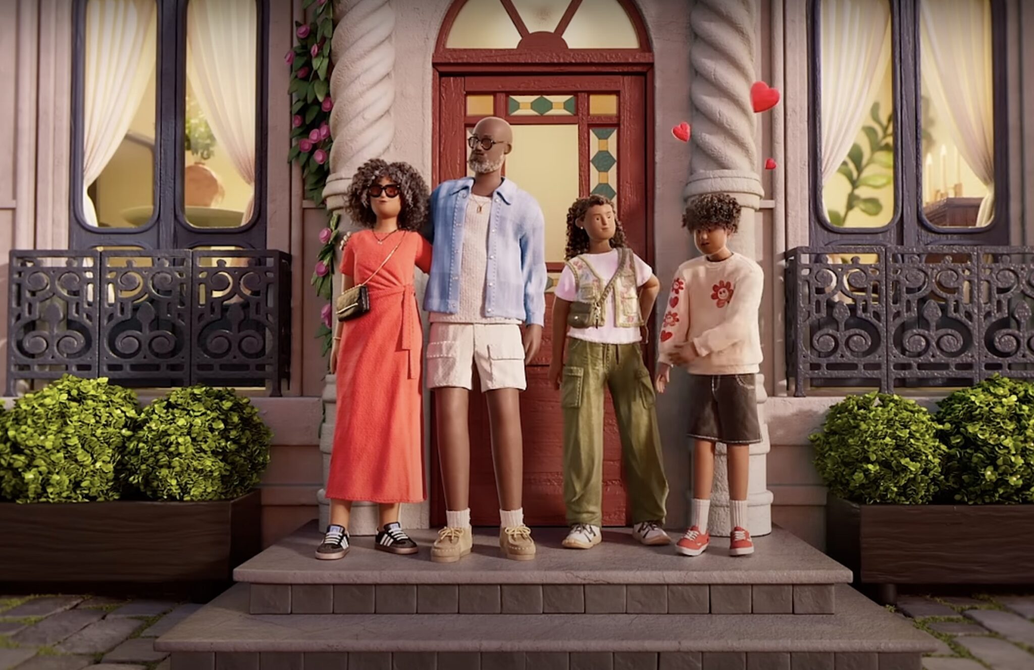 A family standing in front of an Airbnb in Paris.