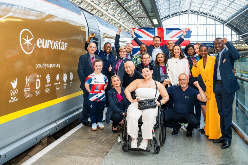 Team GB athletes beside the Eurostar Golden Train