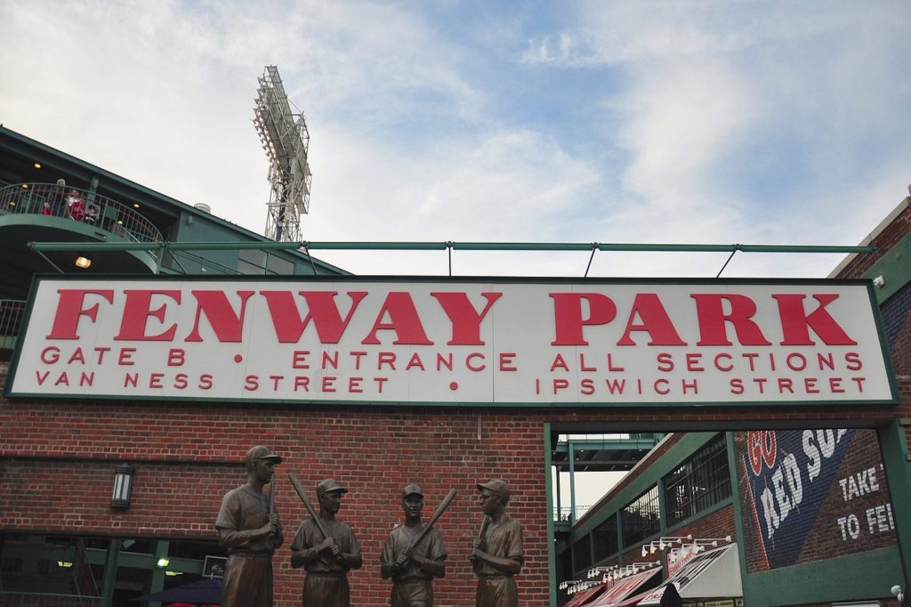 A sign reading Fenway Park at an entrace to the stadium