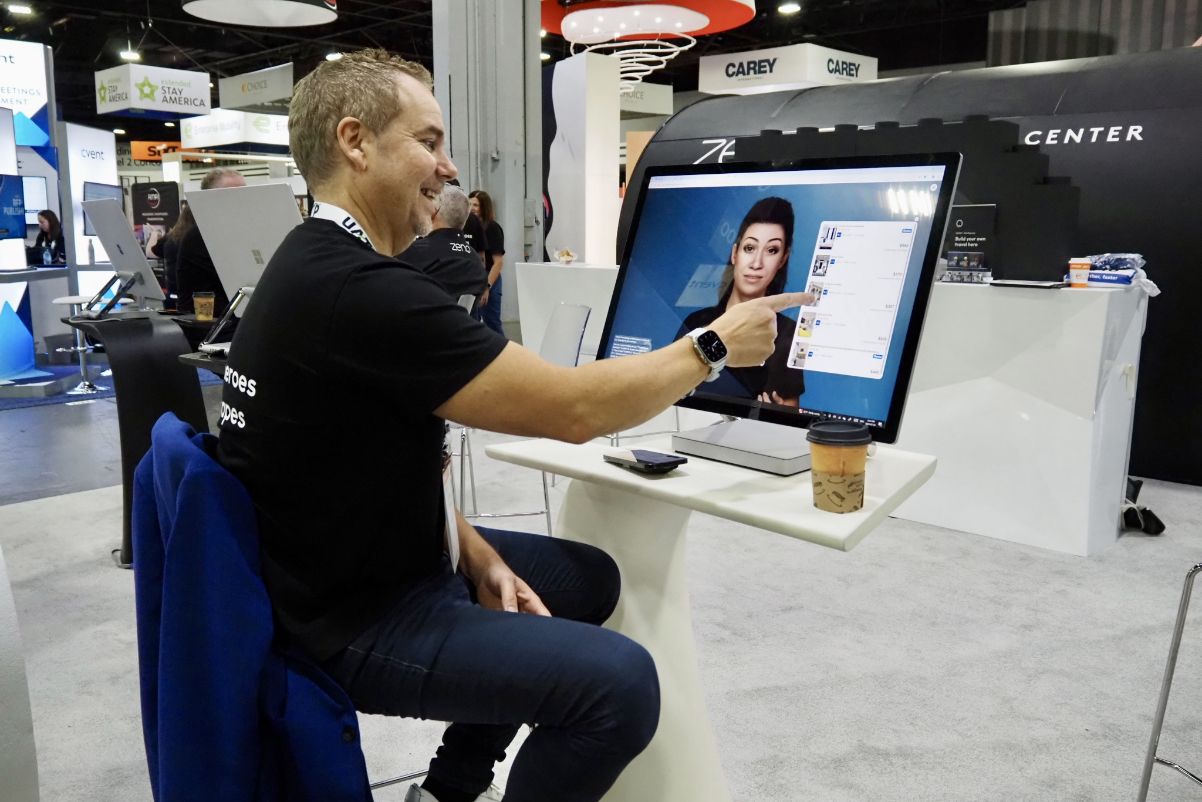 Serko CEO Darrin Grafton demonstrates the AI-powered travel agent conjured up by his company's Zeno platform at the Global Business Travel Association conference in Atlanta in July 2024. 