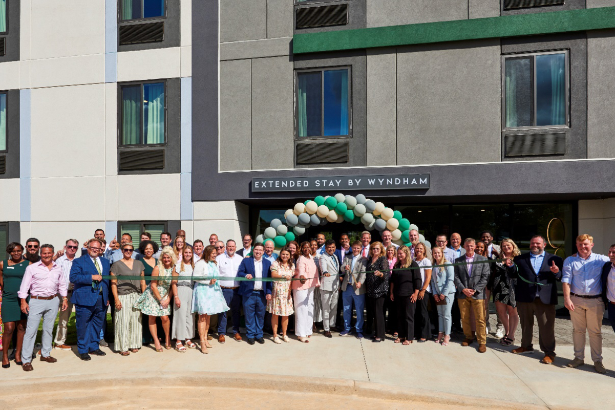 Wyndham executives and local officials celebrate the grand opening of the first ECHO Suites in Spartanburg, South Carolina, in July 2024.