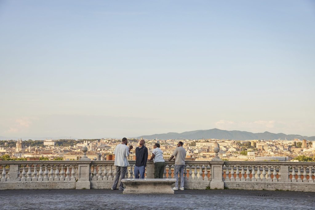 A small group tour looking at the skyline in Rome.