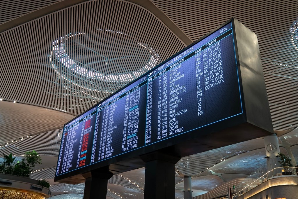 A departures board in an airport