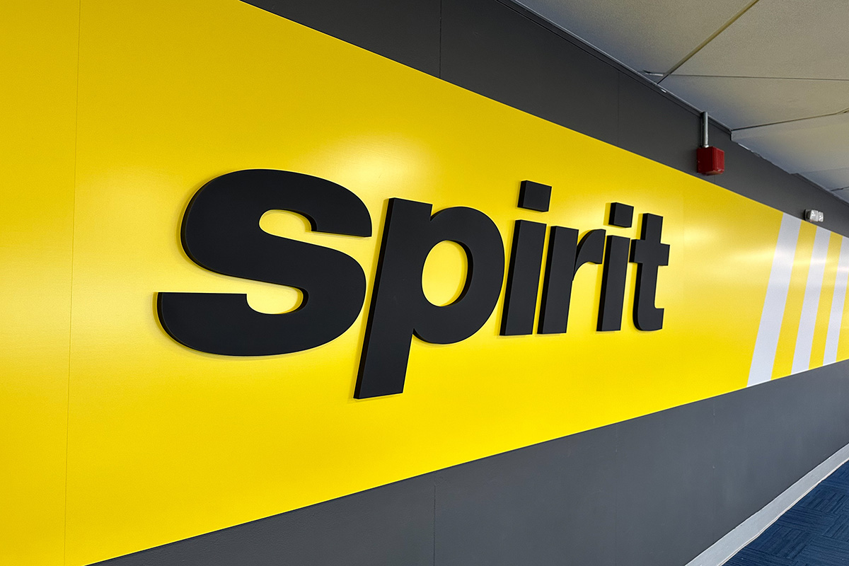 A Spirit Airlines sign at LaGuardia Airport. kenishirotie/Adobe Stock