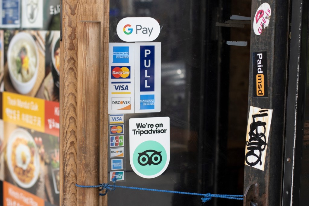 A TripAdvisor sticker at the entrance to a restaurant.