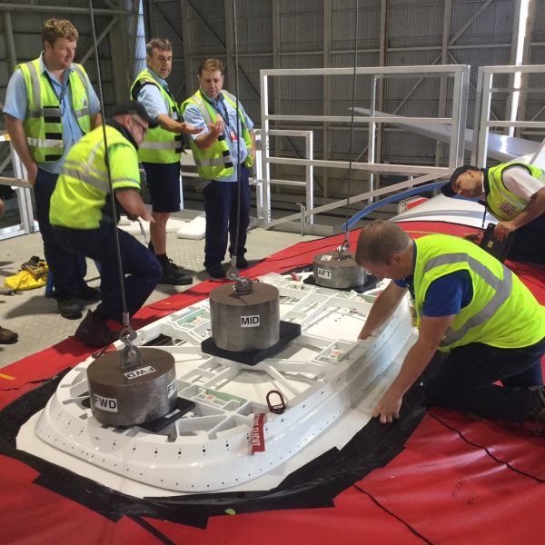 Qantas engineers completing a WiFi installation