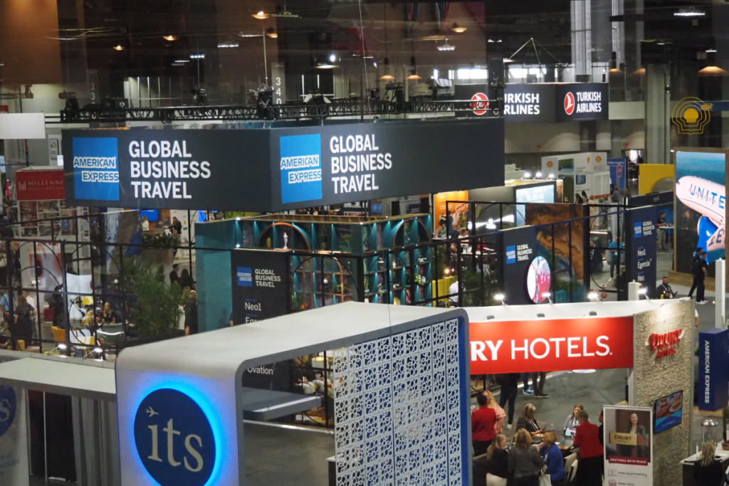 a sign saying american express global business travel at the global business travel association conference in atlanta in july 2024