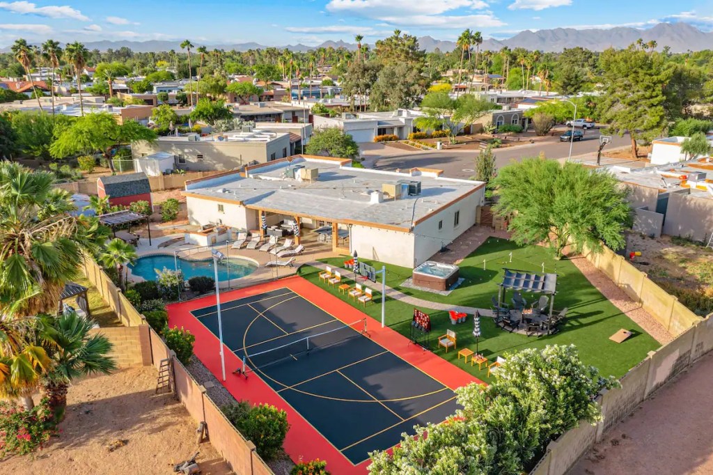 A vacation rental with a tennis court and swimming pool.