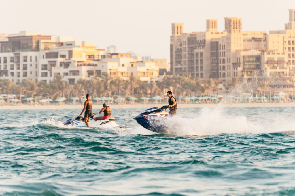 tourists on jetskis in dubai