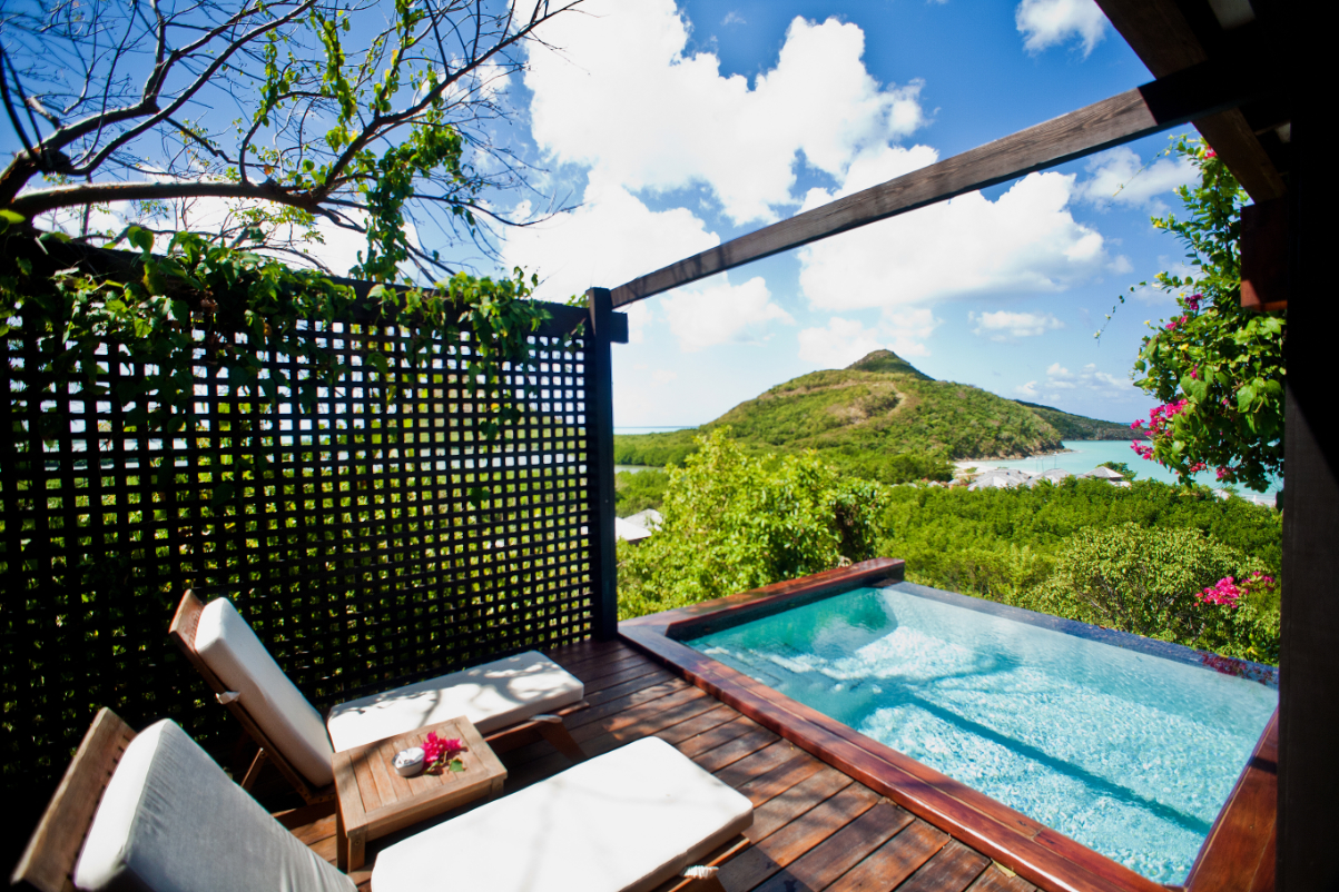 An outdoor pool suite at Hermitage Bay, Antigua, a member of the Small Luxury Hotels of the World collection.