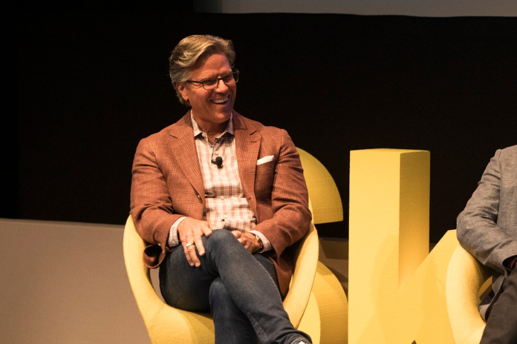 chris hemmeter talking on stage about venture capital at a skift event in new york city