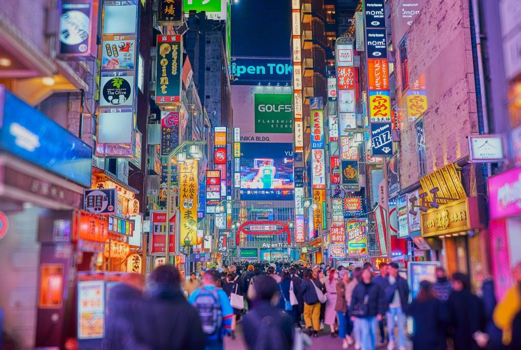 A busy street in Tokyo at nighttime.