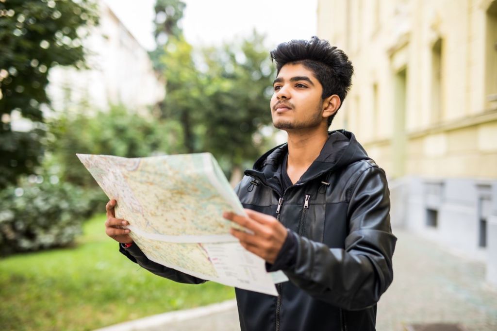 Image: Indian tourist with a map.