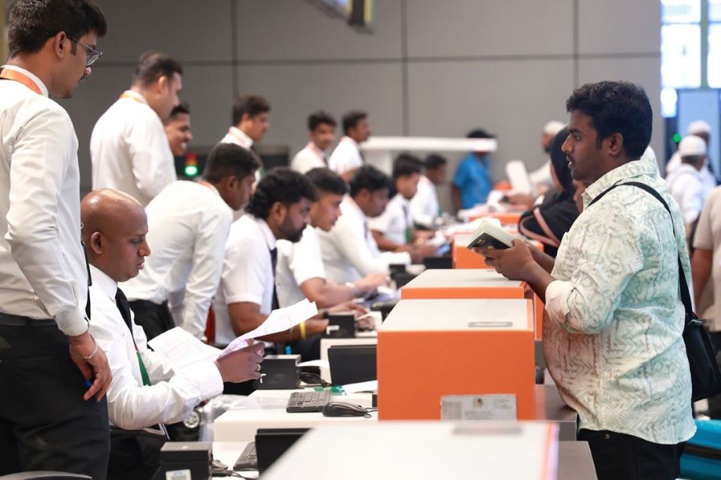 Image: Travelers checking in at Chennai Airport.