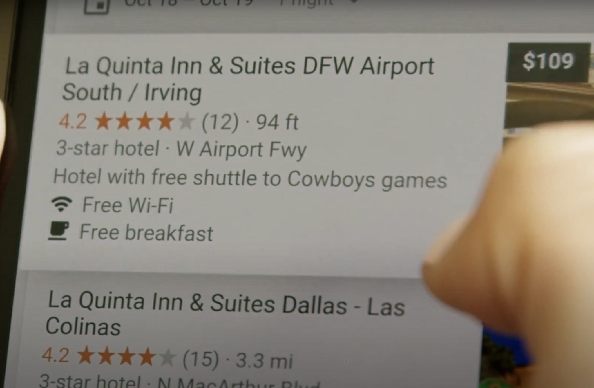 Someone looking at hotel ads on a phone.