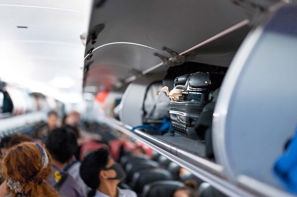 Overhead luggage bins on a plane.