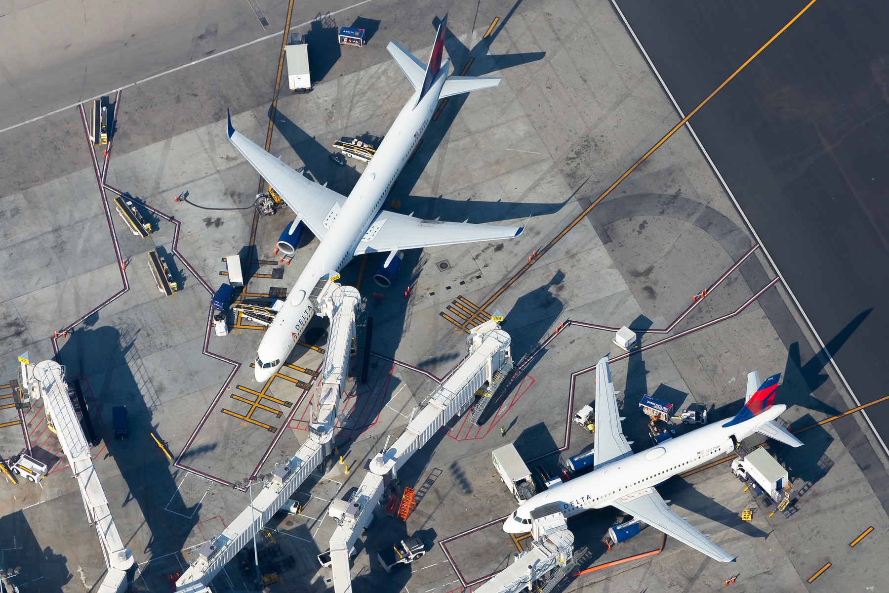 Aerial view of planes at an airport gate