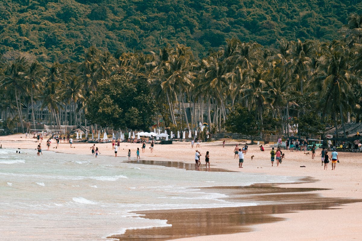 Tourists at a beach in El Nido, Philippines.