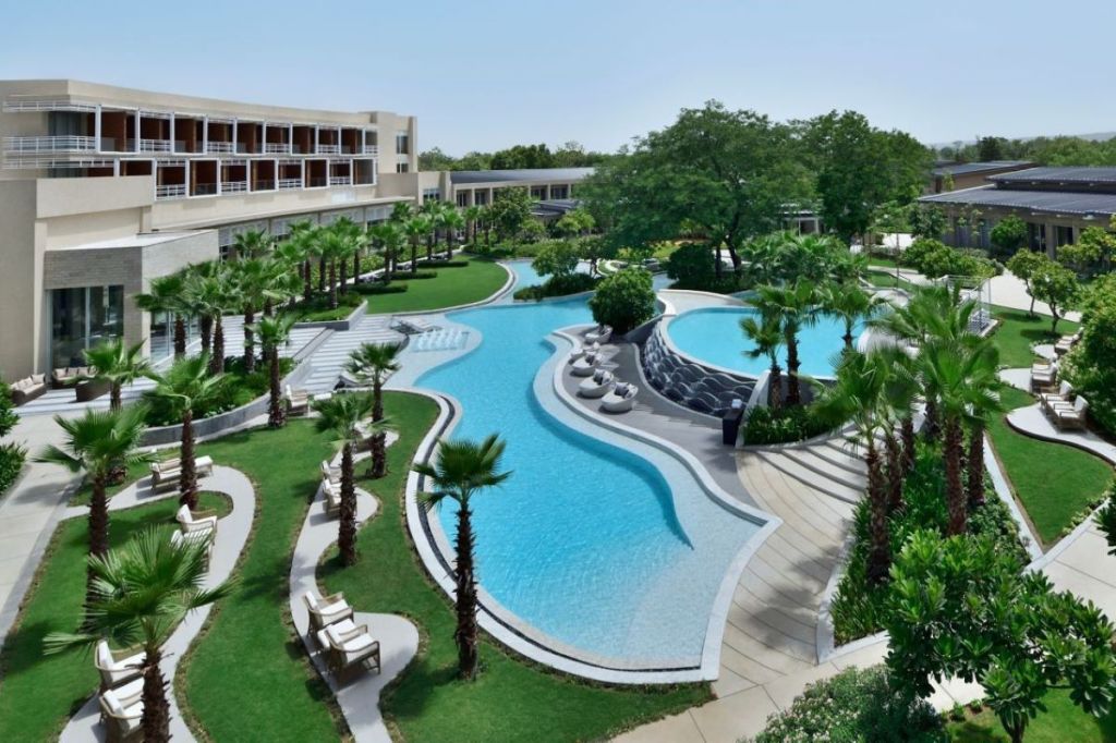 Pool view of Courtyard by Marriott Aravali Resort near Delhi.