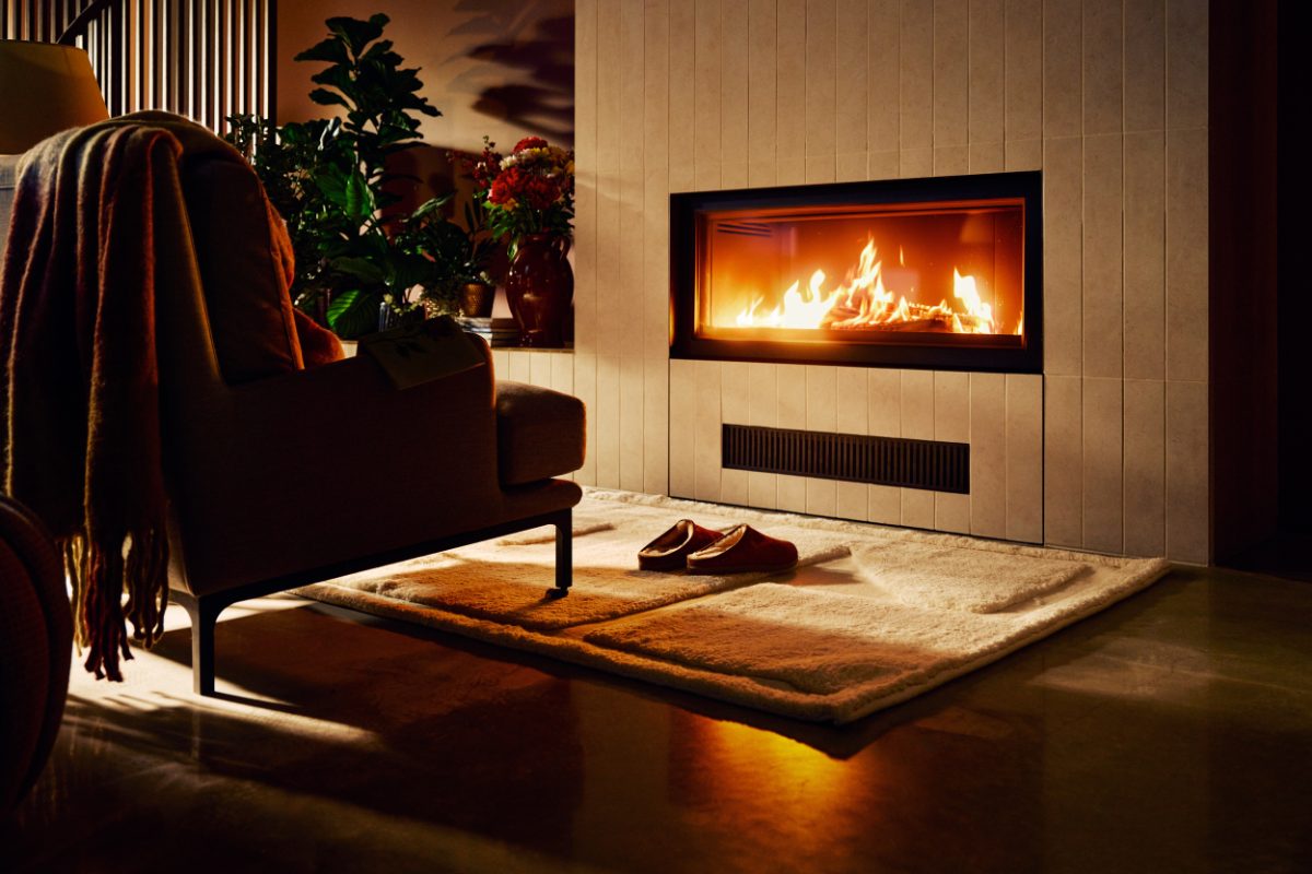 view of a fireplace in a cozy hotel room in Scandinavia