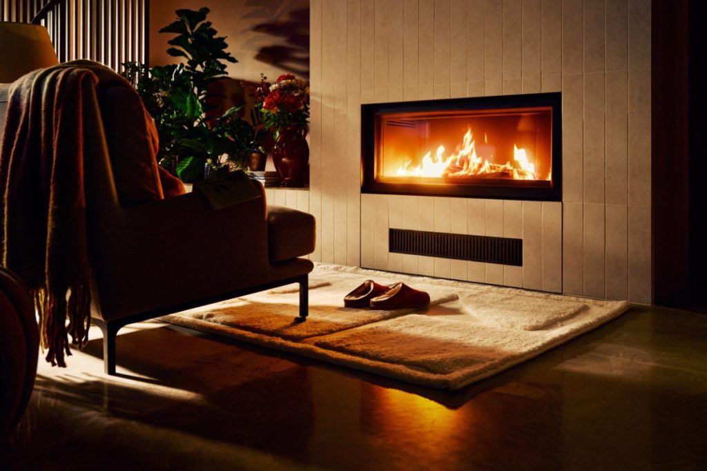 view of a fireplace in a cozy hotel room in Scandinavia