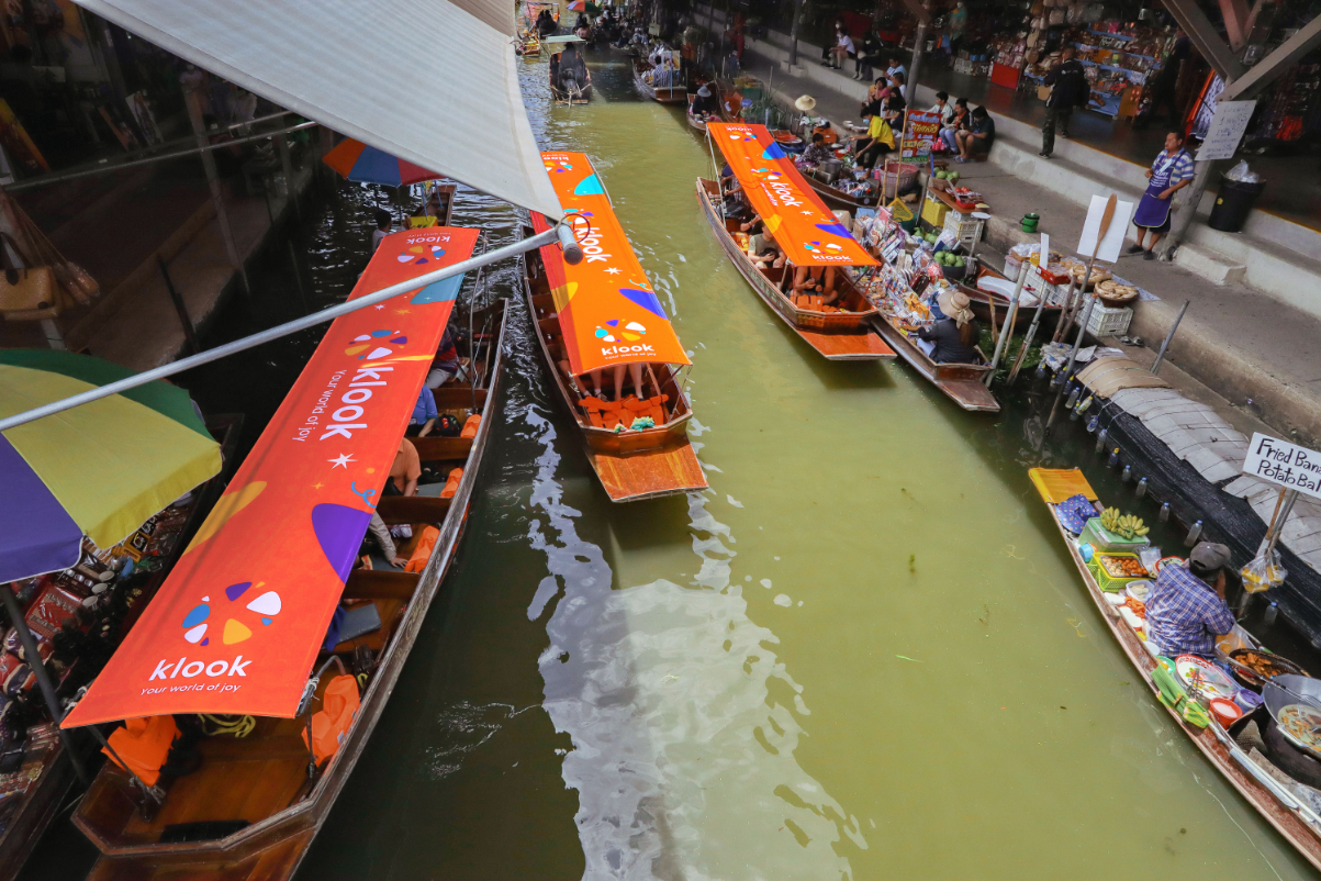 image of tourist boats in the floating market in Bangkok Thailand