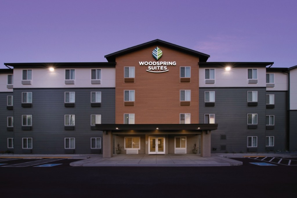 Exterior of a multi-story hotel at night.