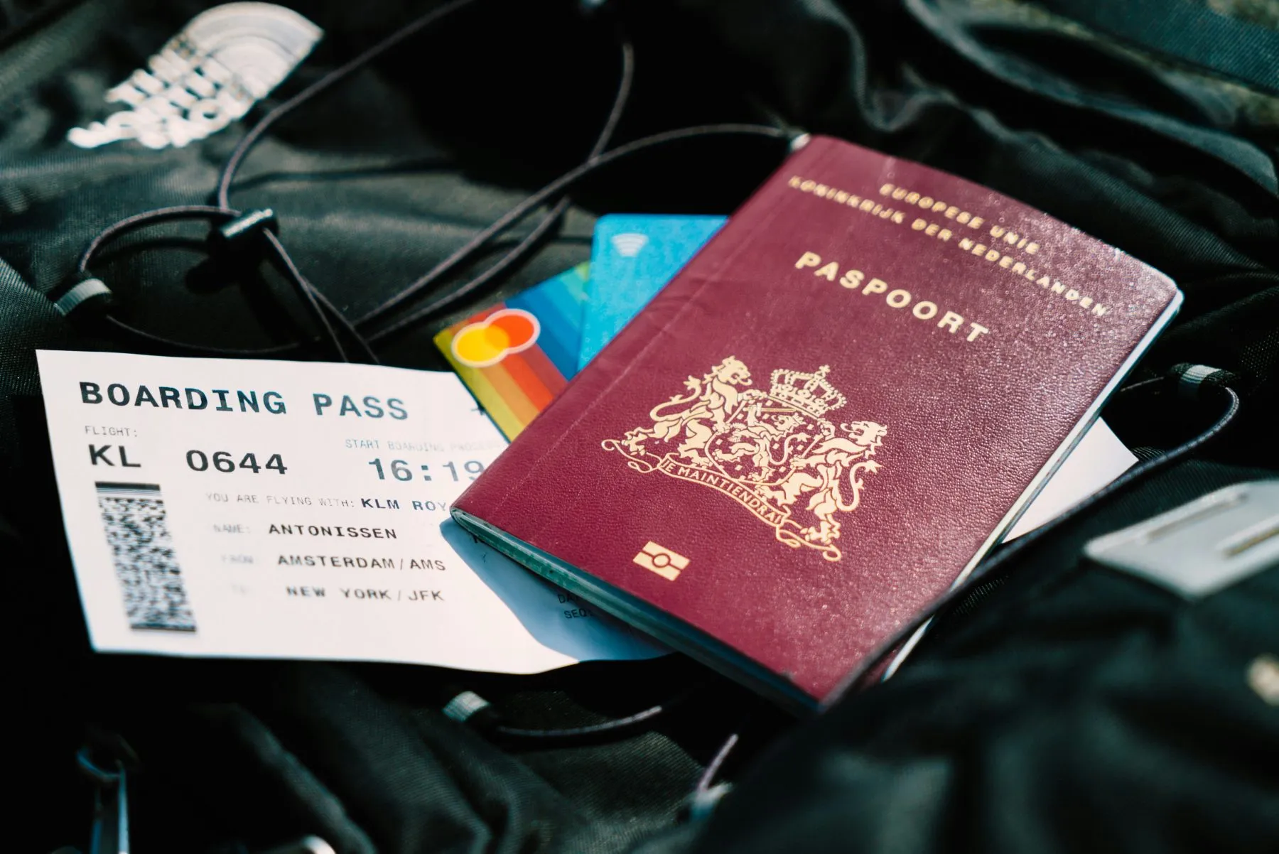 A file image of a passport and airline boarding pass.