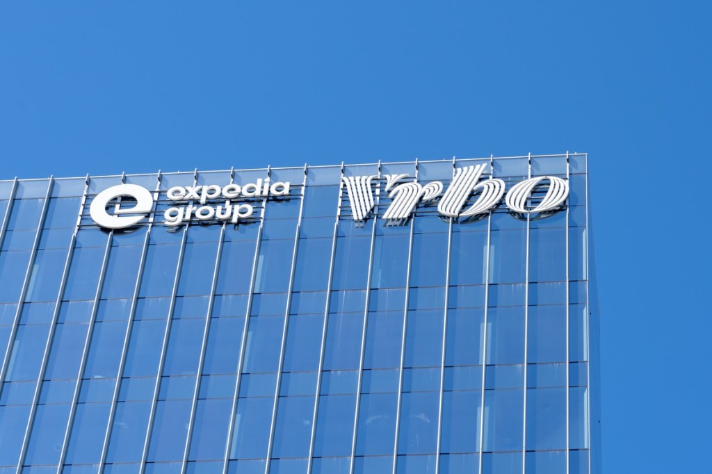 Exterior of an office building with a blue sky behind it.