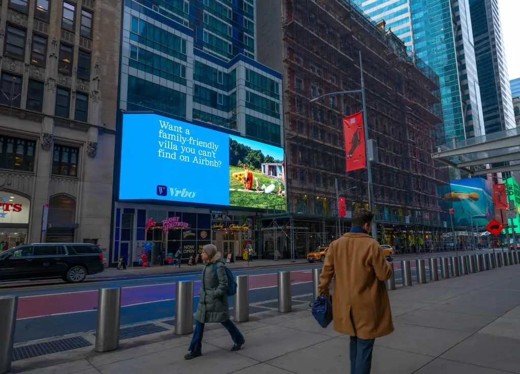 A Vrbo billboard tweaking Airbnb near Bryant Park in New York.