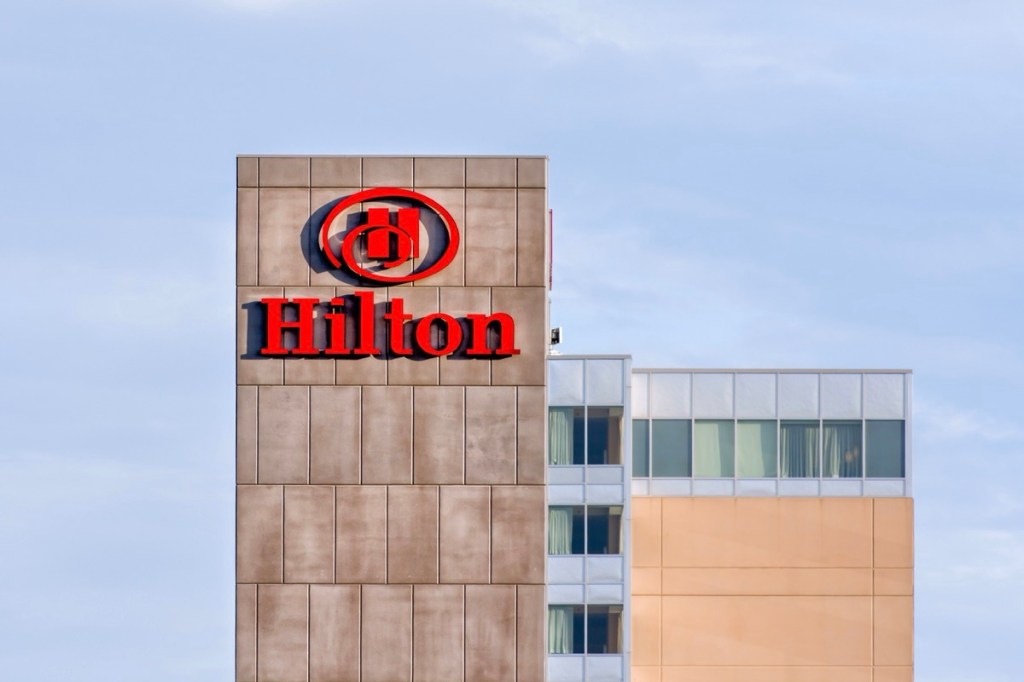 Exterior of the top floors of a Hilton hotel