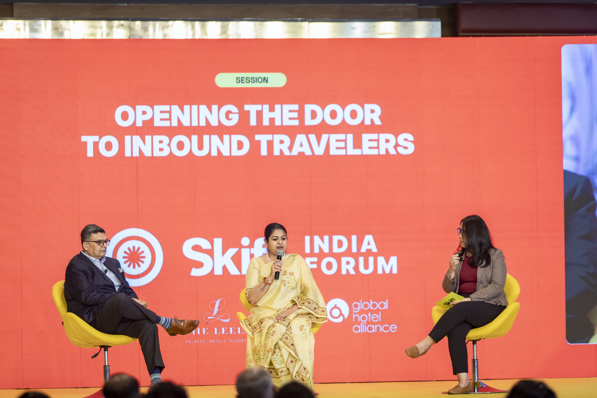 Dipak Deva, Managing Director and CEO, Travel Corporation India Ltd, and Mugdha Sinha, Managing Director, India Tourism Development Corporation, with Peden Doma Bhutia, Skift Asia Editor at Skift India Forum 2025