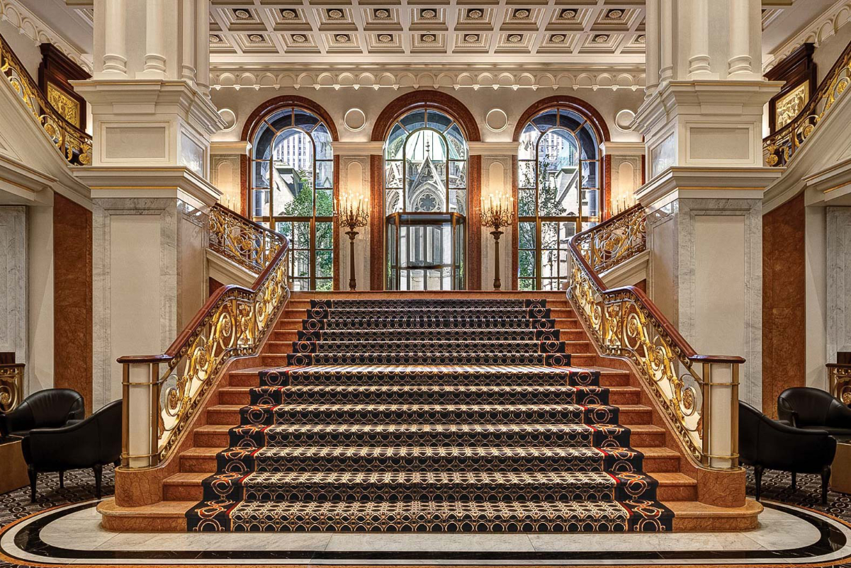 image of a grand staircase in a luxury hotel lobby