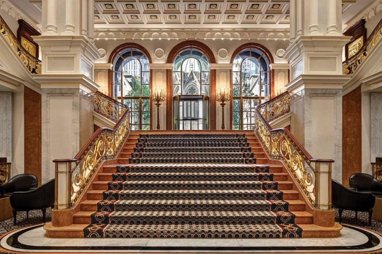 image of a grand staircase in a luxury hotel lobby